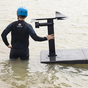 Firduo Rider in Wetsuit Holding eFoil Board with 75141 Thruster and Hydrofoil Mast in Open Water – Real-World Use Scene
