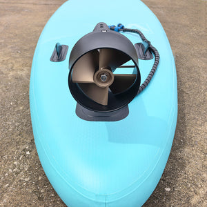 Firduo T2000 Underwater Thruster Mounted on Light Blue SUP Board – Top-Down View Showing JP120 4-Blade Propeller and Fin Box Bracket